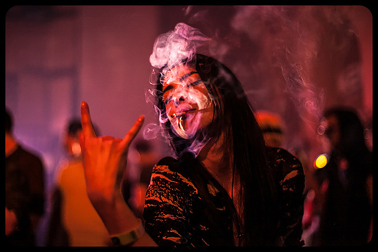 A club portrait in pink smoke